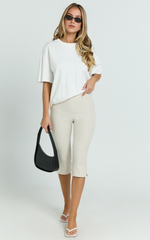 Susannah Cream Pinstripe Split-Hem Cropped Trousers – Tailored Elegance in Motion