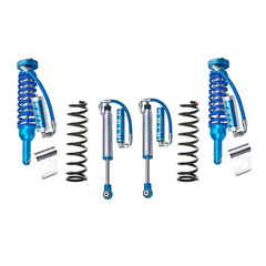 A set of blue King Shocks with outstanding off-road performance and exceptional damping characteristics, showcased on a pristine white background.