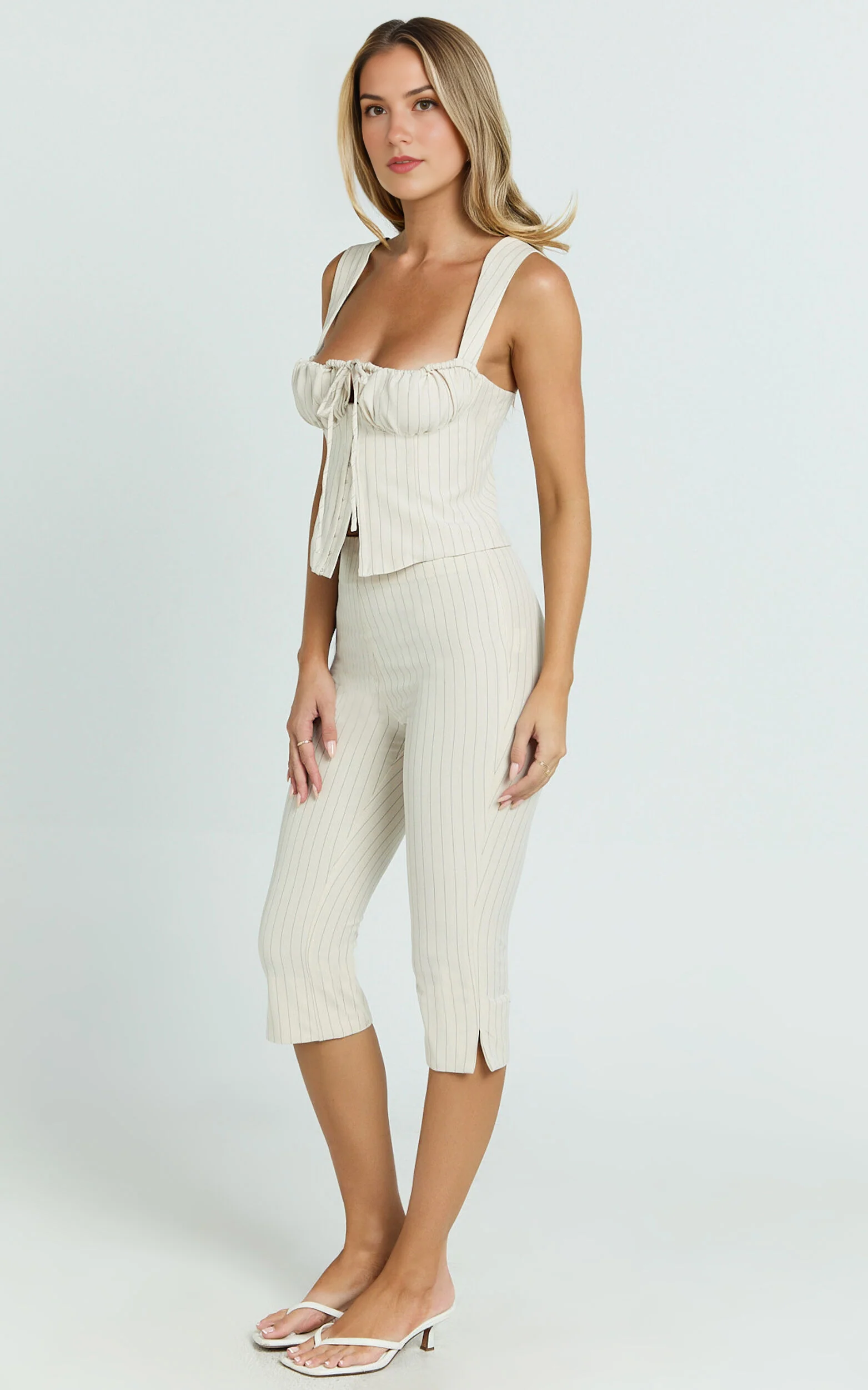 Susannah Cream Pinstripe Split-Hem Cropped Trousers – Tailored Elegance in Motion