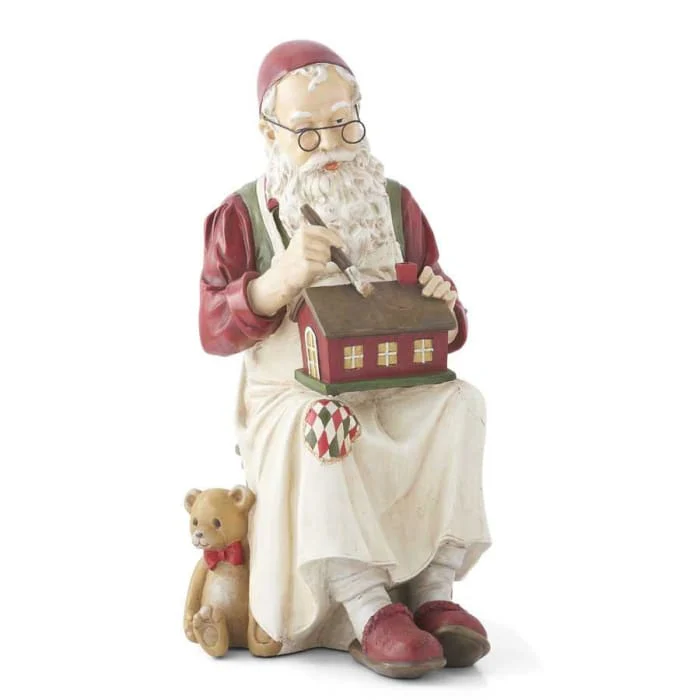 Christmas Santa Claus Figurine Sitting And Painting House